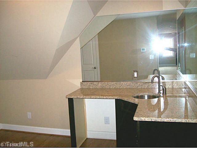 5628 Cape Fox Drive Oak Ridge, NC 27310 - Photo 14 of 16 Game. Game room has wet bar and hardwood floors as well as storage closet