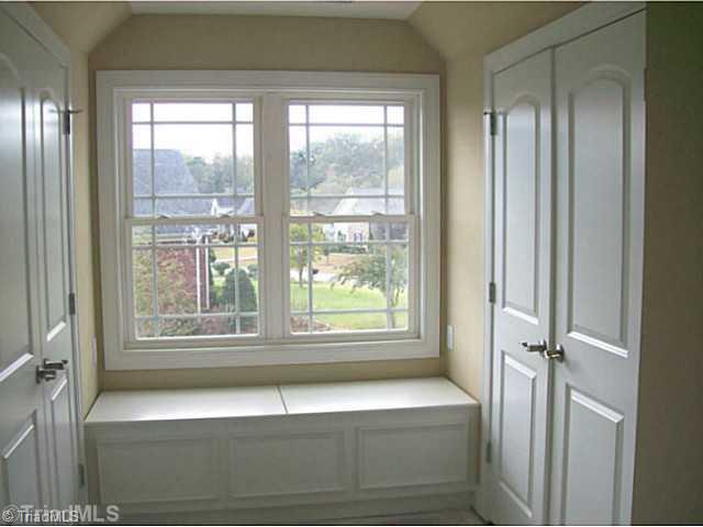 5628 Cape Fox Drive Oak Ridge, NC 27310 - Photo 15 of 16 4th Bedroom. All bedrooms have abundant closet space. This one has two and a window seat with extra storage. Too cute