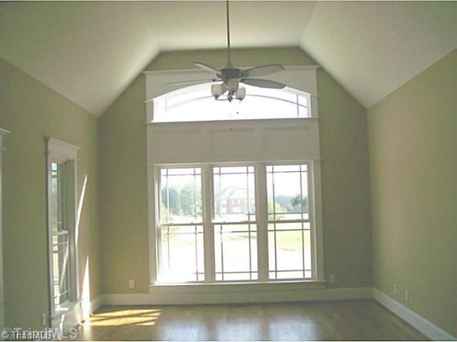 5628 Cape Fox Drive Oak Ridge, NC 27310 - Photo 5 of 16 Keeping Room. Sunny and open. Tall ceiling and hardwood floors.