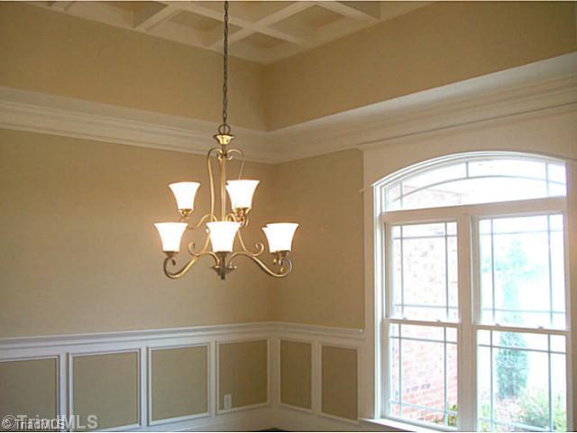 5628 Cape Fox Drive Oak Ridge, NC 27310 - Photo 7 of 16 Dining Room. Unique custom coffered ceiling, wainscoting and chair rail on hardwood floor