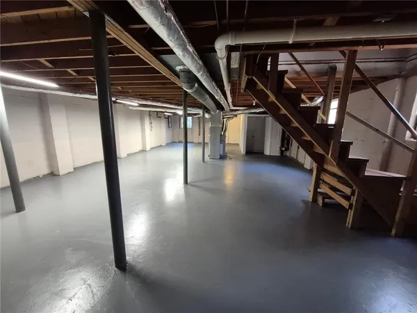 a view of a room with wooden floor