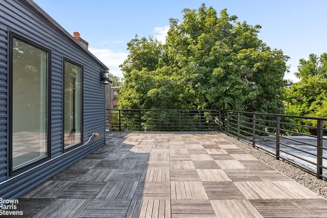 a bathroom with a sink a toilet a mirror and shower
