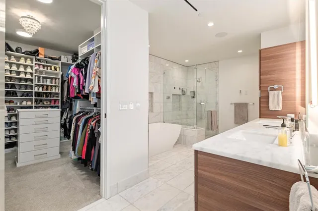 a bathroom with a bathtub and shower