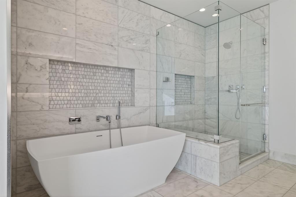 7901 Windrose Avenue, Unit 1701 Plano, TX 75024 - Photo 25 of 40 a bathroom with a bathtub and shower
