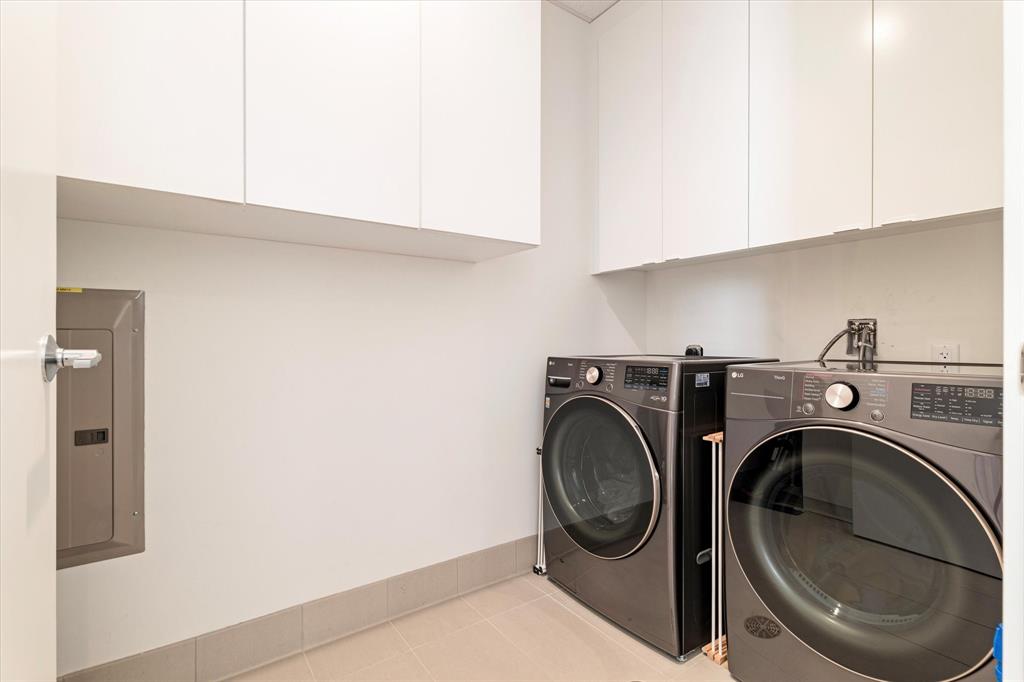 7901 Windrose Avenue, Unit 1701 Plano, TX 75024 - Photo 31 of 40 a utility room with dryer and washer