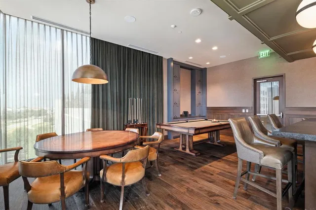 a view of a patio with a table and chairs
