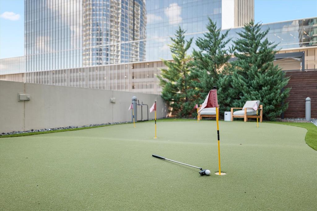 7901 Windrose Avenue, Unit 1701 Plano, TX 75024 - Photo 37 of 40 a view of a patio with a table and chairs