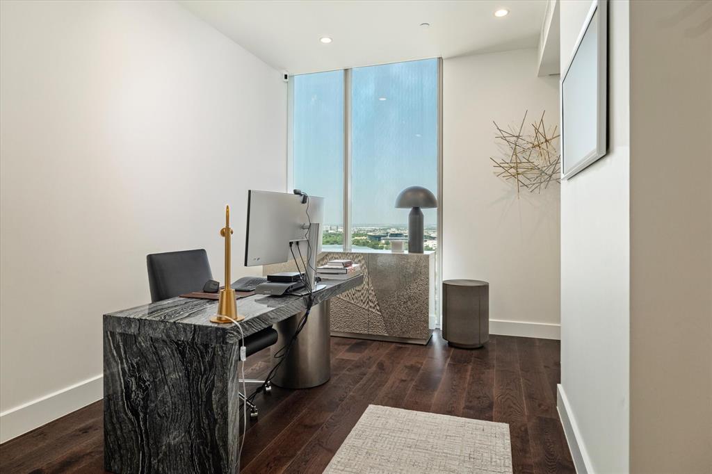7901 Windrose Avenue, Unit 1701 Plano, TX 75024 - Photo 4 of 40 a view of a workspace with furniture and wooden floor