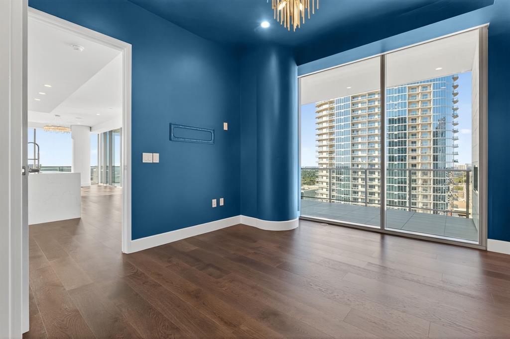 7901 Windrose Avenue, Unit 1701 Plano, TX 75024 - Photo 9 of 40 wooden floor in an empty room with a window