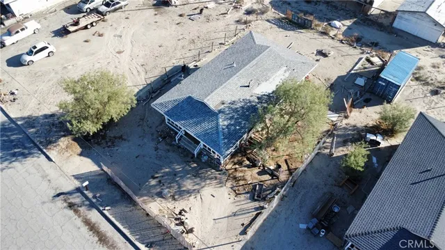 a view of a house with a yard covered in snow