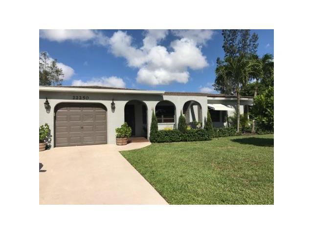 22250 Garrison Street Boca Raton, FL 33428 - Photo 1 of 26 a black and white photo of a house