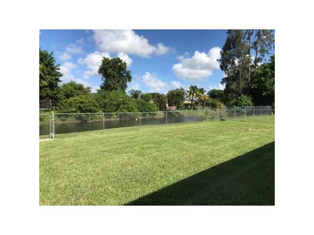 22250 Garrison Street Boca Raton, FL 33428 - Photo 6 of 26 a open view of a garden and a yard