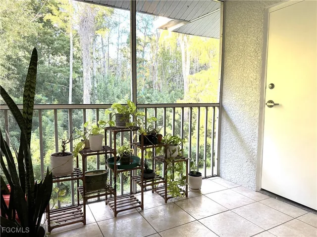 a view of a balcony with chairs
