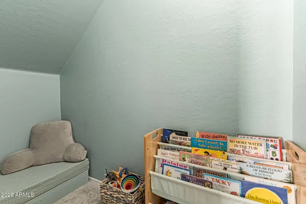a room with toys and dresser