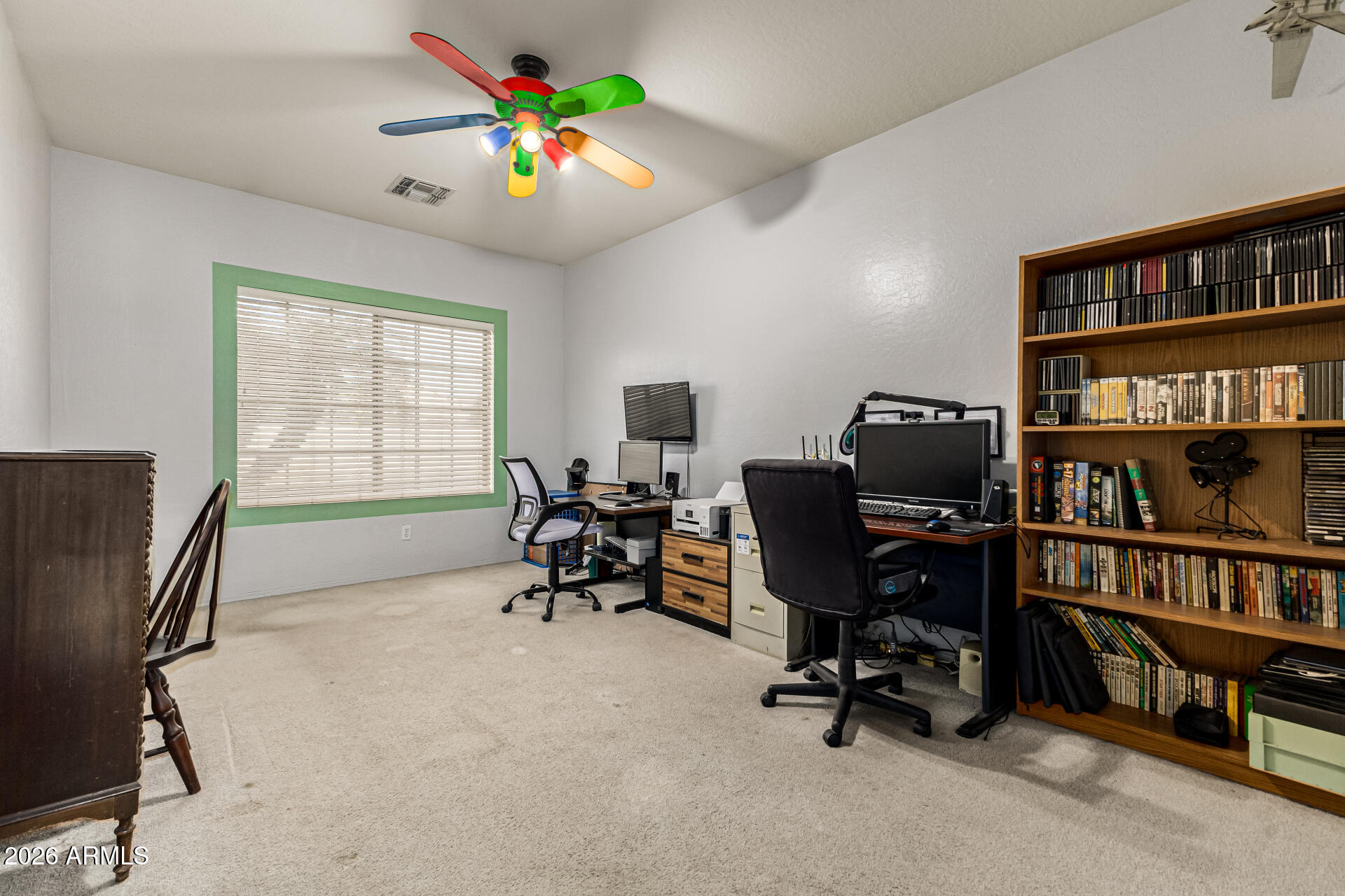 2326 South Porter Street Gilbert, AZ 85295 - Photo 14 of 29 a view of a workspace with furniture and a bookshelf