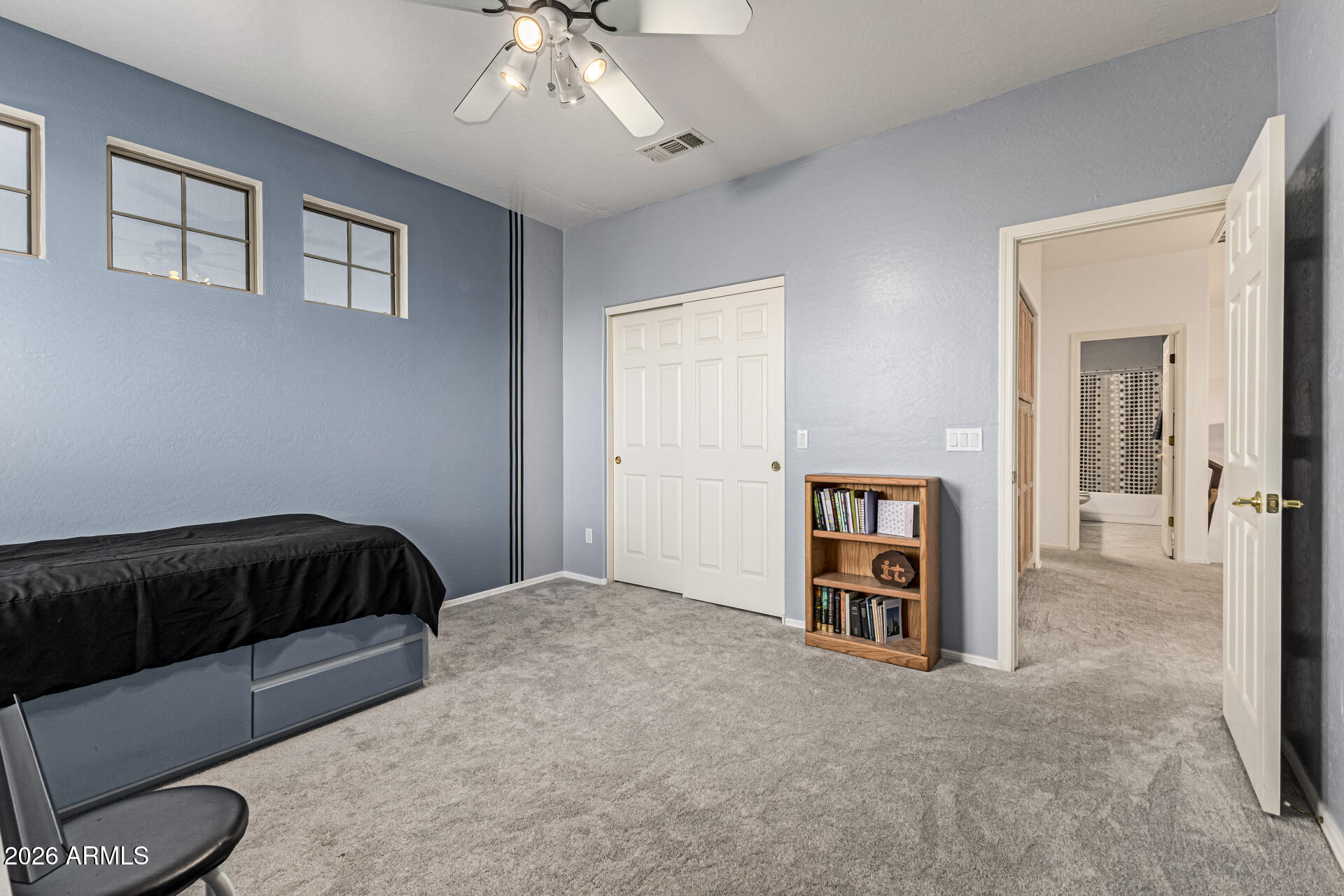 2326 South Porter Street Gilbert, AZ 85295 - Photo 17 of 29 a bedroom with a bed and a chandelier