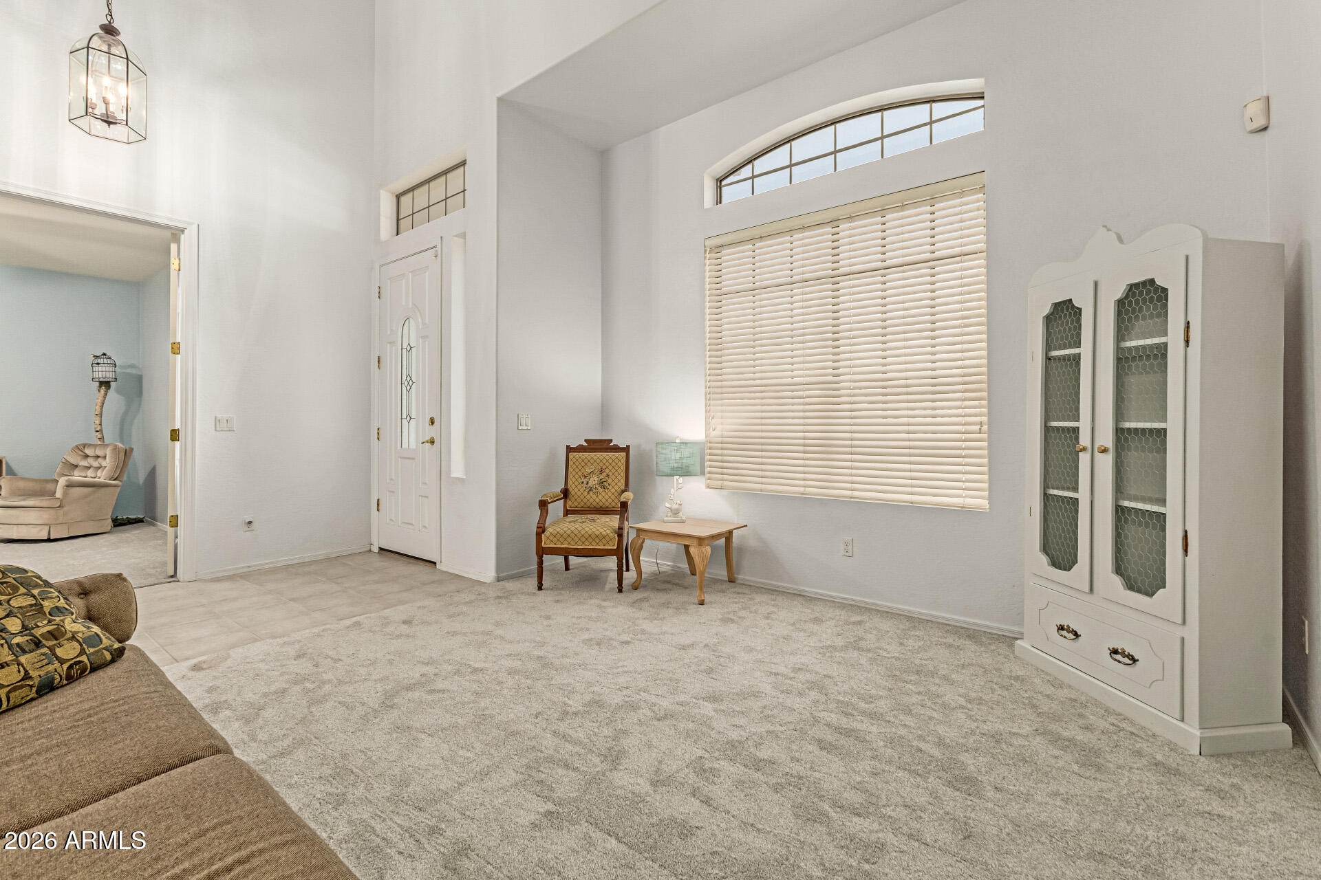 2326 South Porter Street Gilbert, AZ 85295 - Photo 2 of 29 a spacious bedroom with a bed and a window