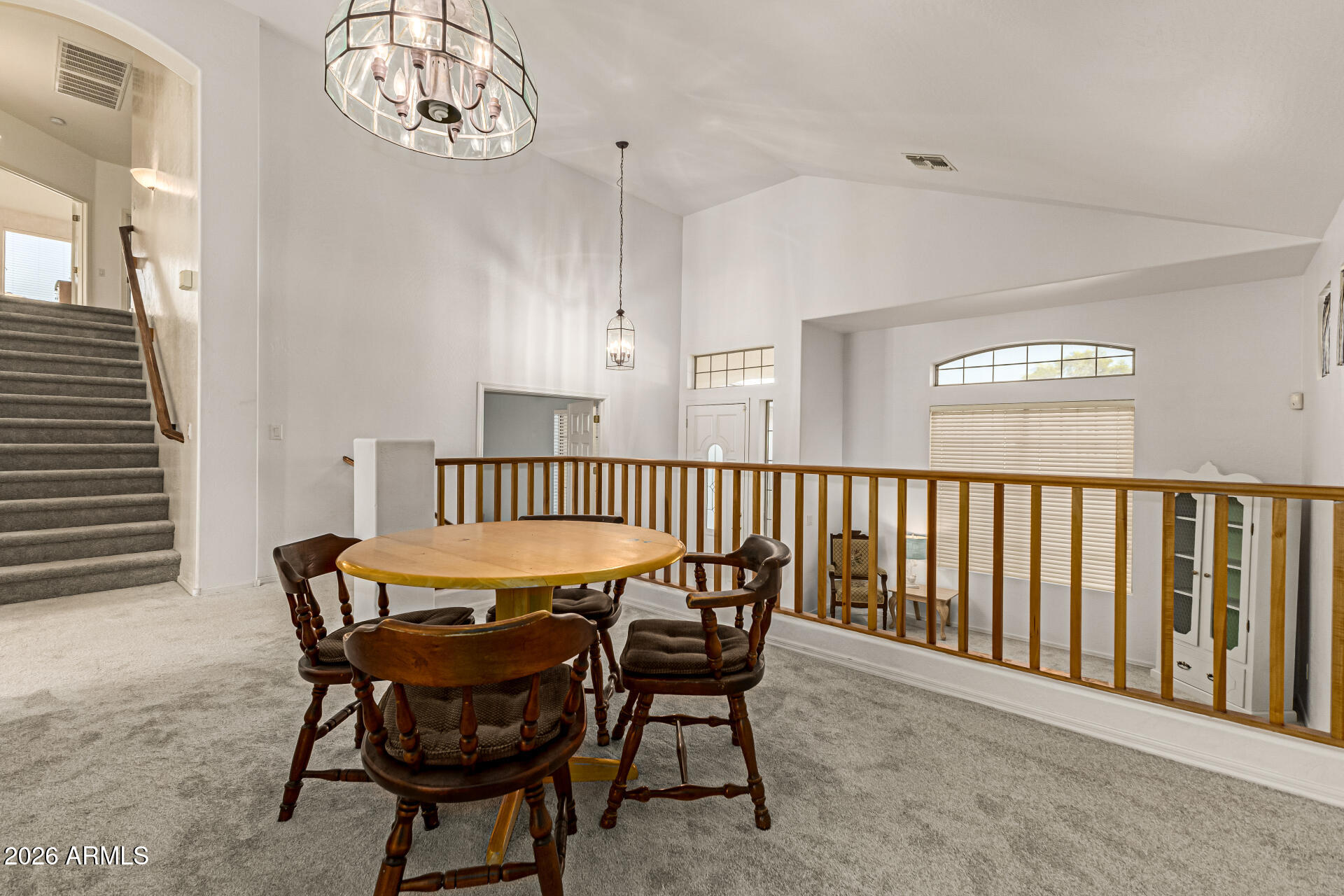 2326 South Porter Street Gilbert, AZ 85295 - Photo 4 of 29 a dining room with furniture and a chandelier