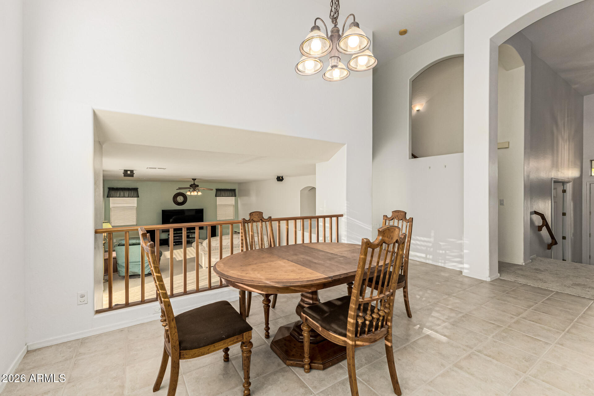 2326 South Porter Street Gilbert, AZ 85295 - Photo 6 of 29 a view of a dining room with furniture and chandelier