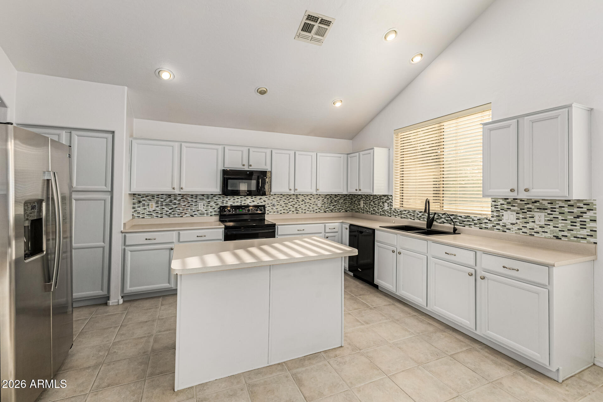 2326 South Porter Street Gilbert, AZ 85295 - Photo 7 of 29 a kitchen with cabinets stainless steel appliances and a counter space