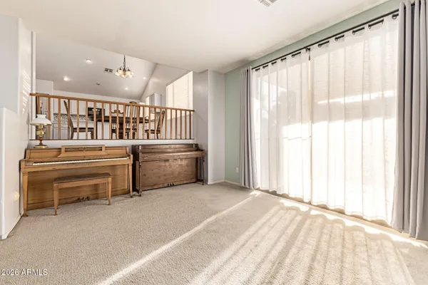 a living room filled with furniture and a window