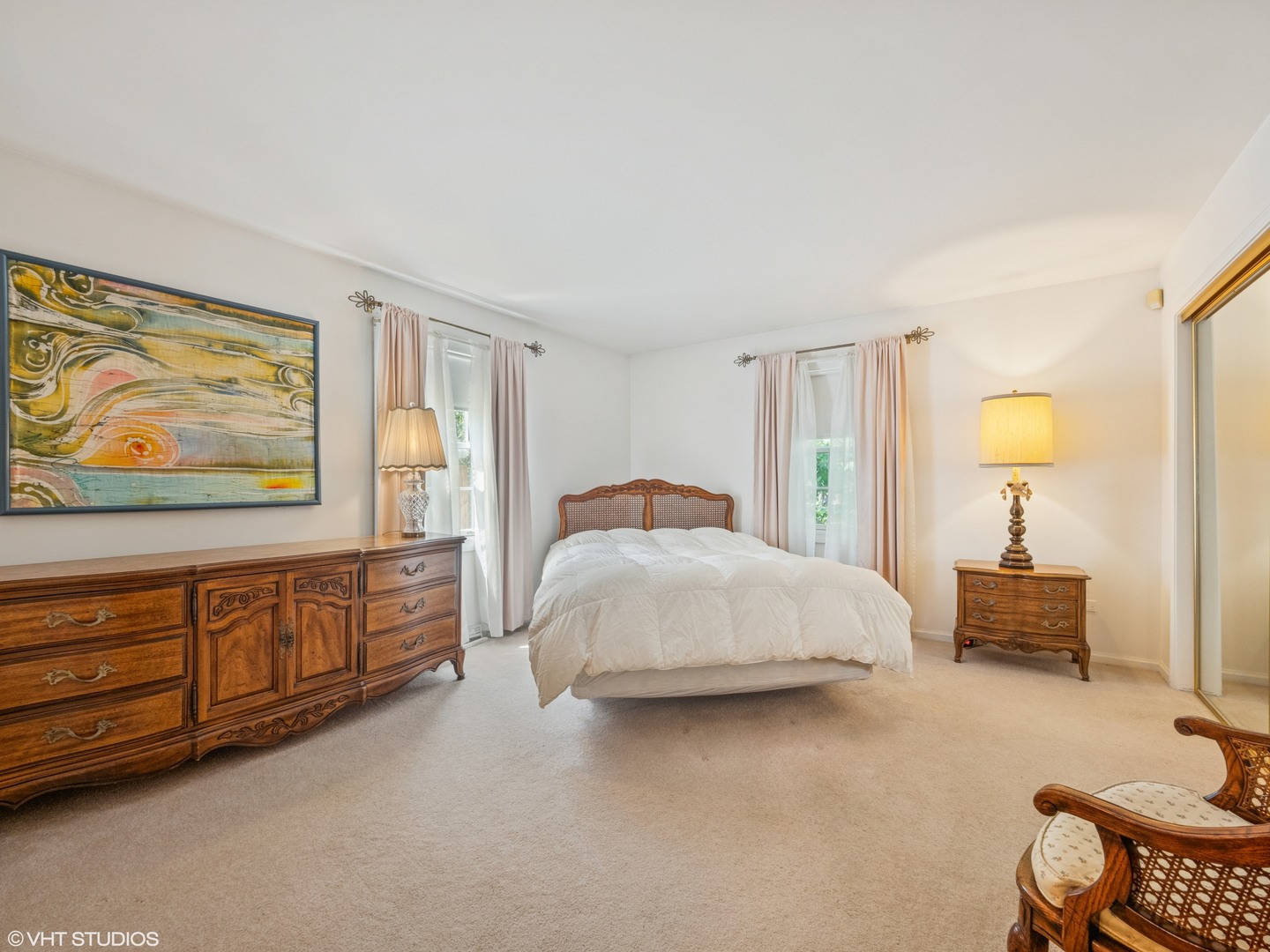 1881 West Tweed Road Inverness, IL 60067 - Photo 12 of 22 a spacious bedroom with a bed a dresser and painting on the wall