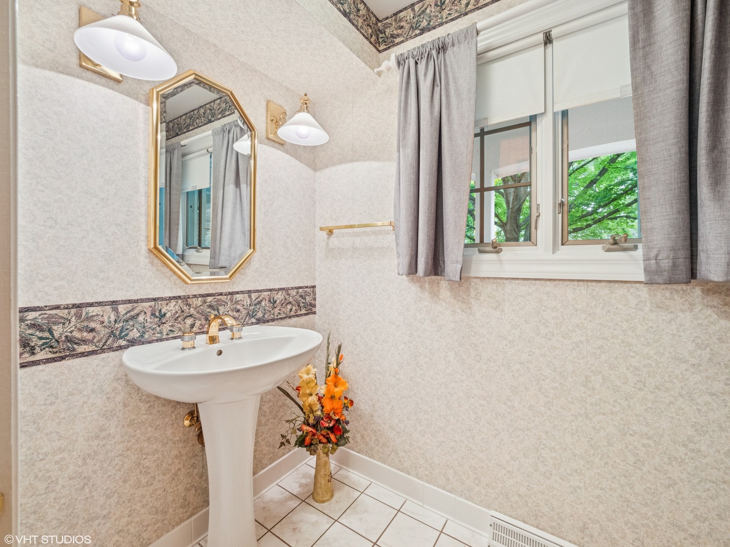 1881 West Tweed Road Inverness, IL 60067 - Photo 16 of 22 a bathroom with a sink and a mirror