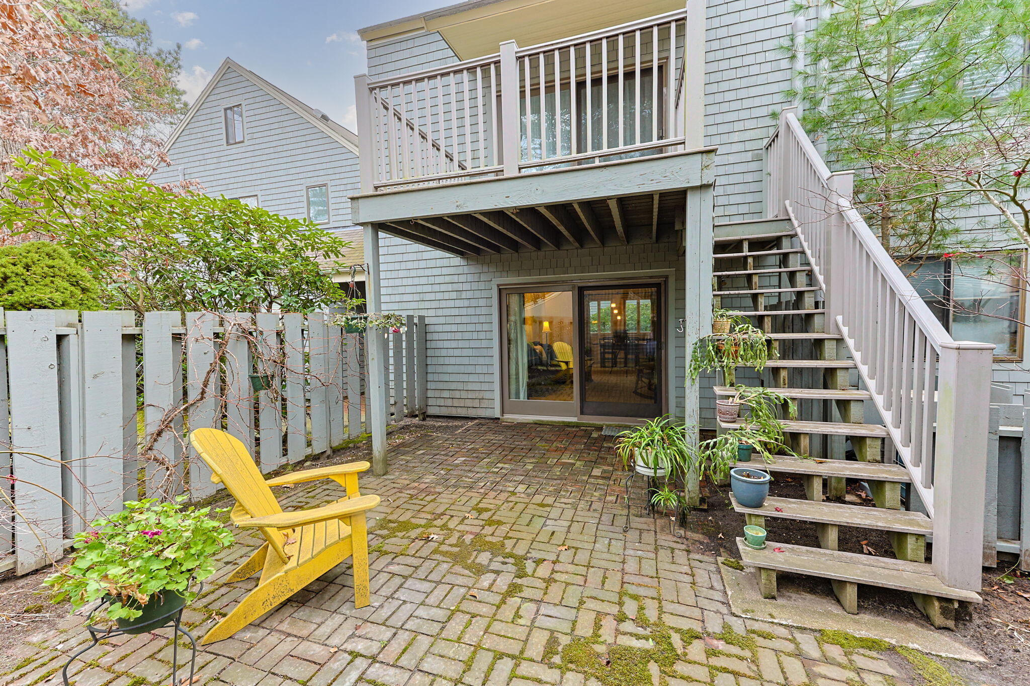 23 Landing Lane, Unit 23 Brewster, MA 02631 - Photo 18 of 33 a view of a house with backyard and wooden fence