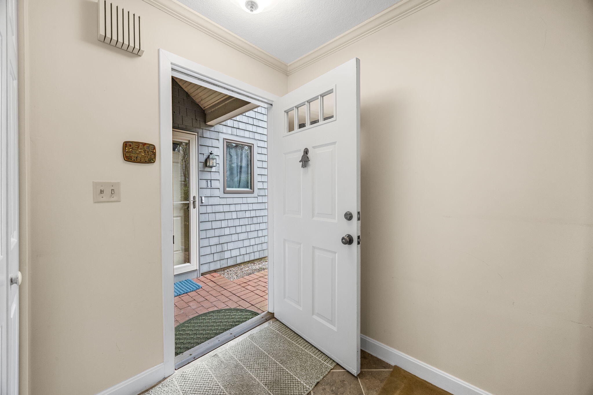 23 Landing Lane, Unit 23 Brewster, MA 02631 - Photo 4 of 33 a view of front door of house