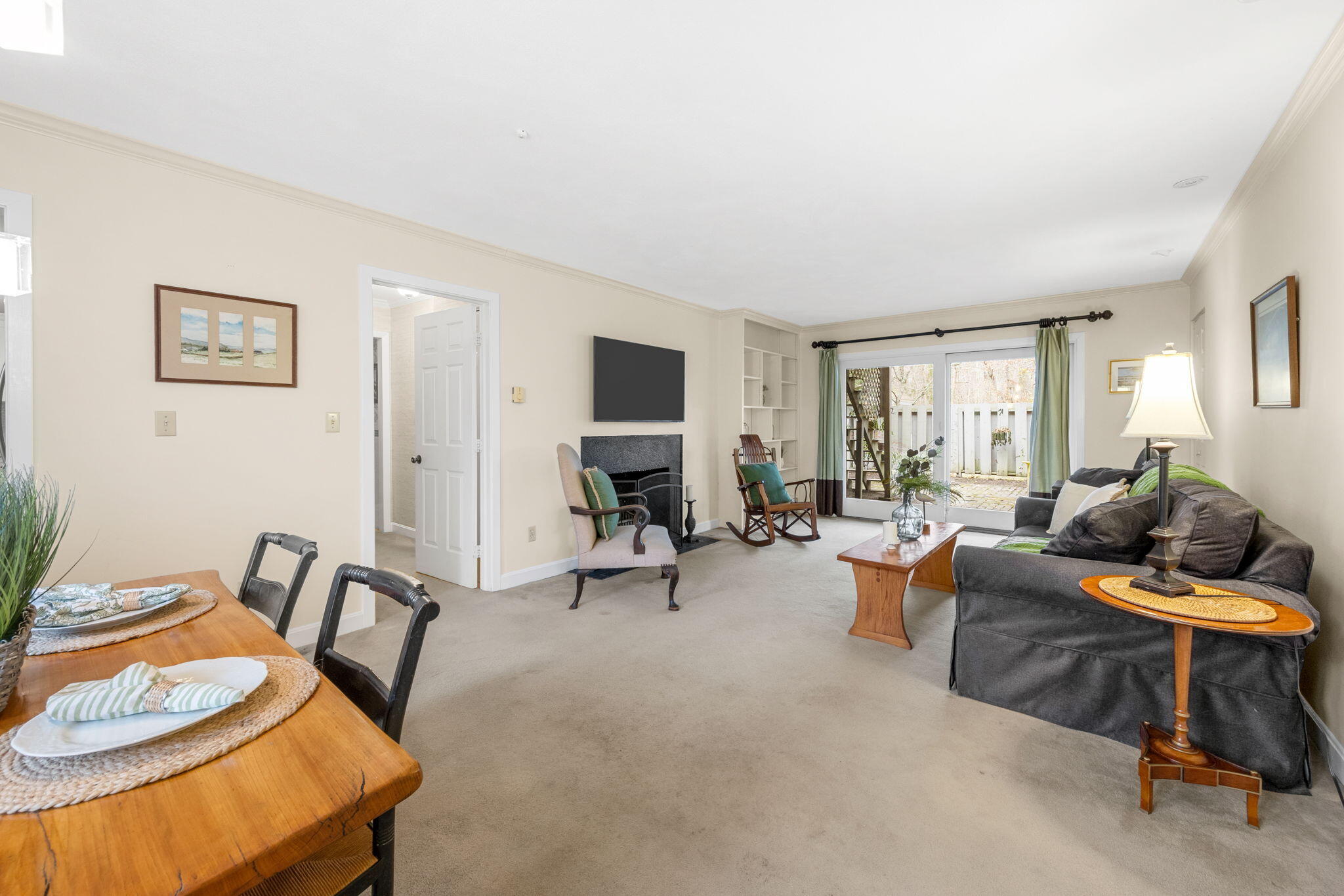 23 Landing Lane, Unit 23 Brewster, MA 02631 - Photo 7 of 33 a living room with furniture a window and a table