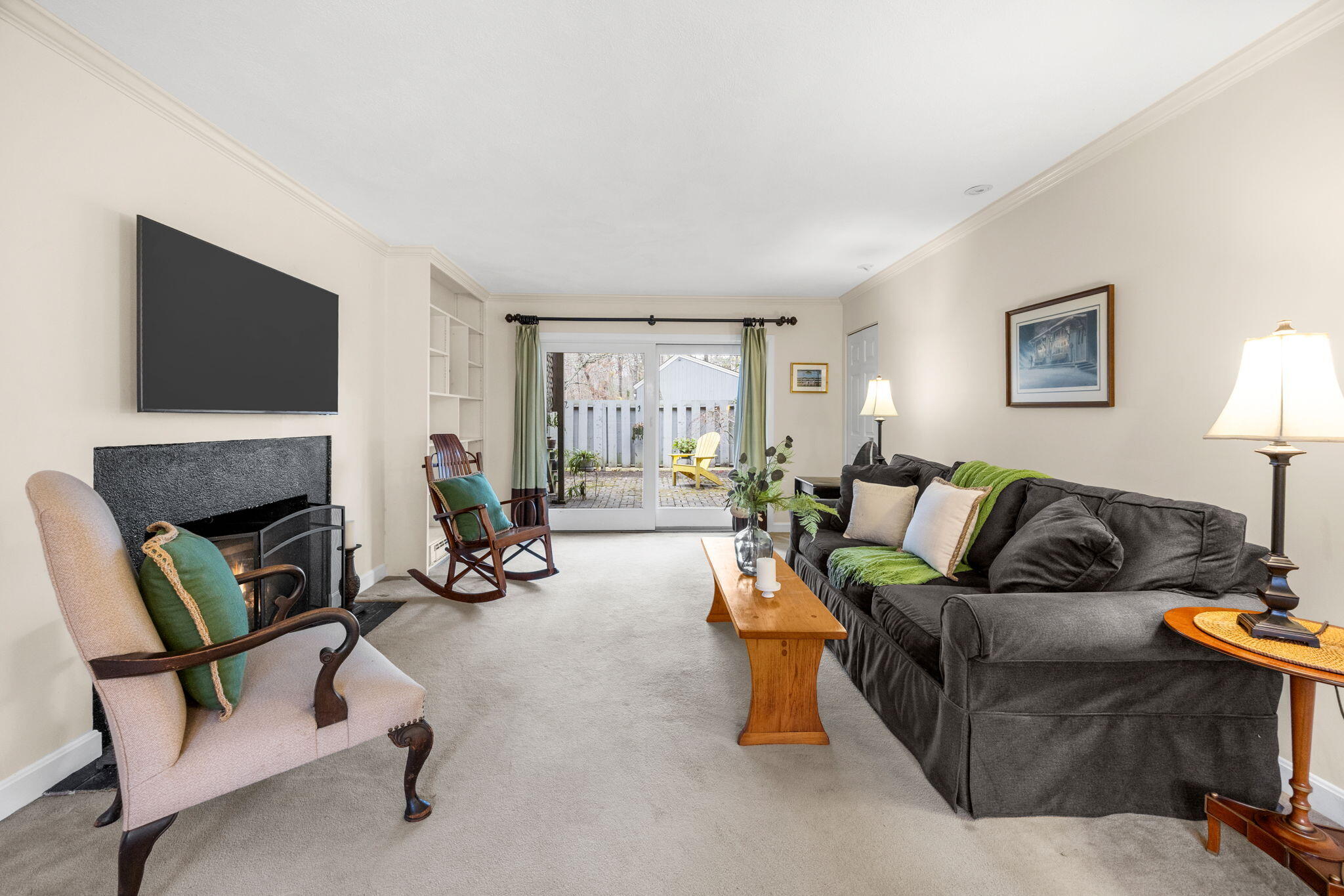 23 Landing Lane, Unit 23 Brewster, MA 02631 - Photo 8 of 33 a living room with furniture and a fireplace