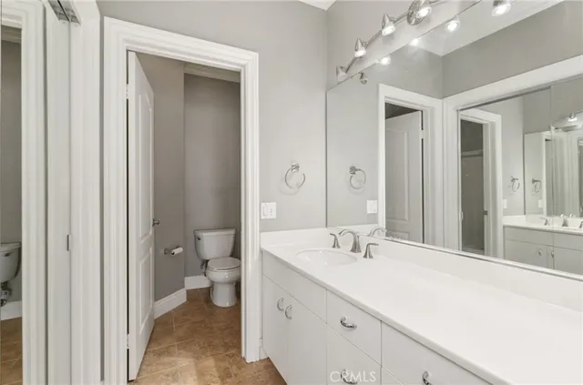 a view of empty room with wooden floor and fireplace