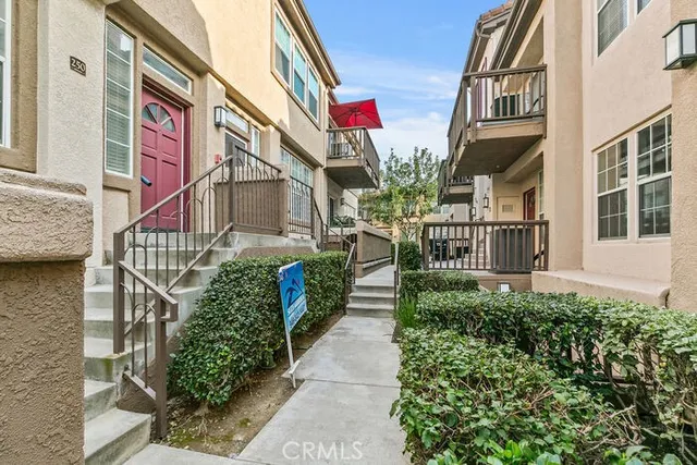 a view of kitchen with stainless steel appliances granite countertop a stove and a refrigerator