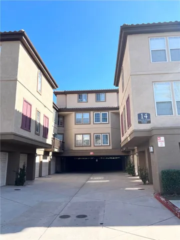 a view of multiple houses with a street