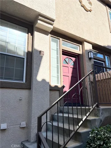 a white toilet sitting next to a shower
