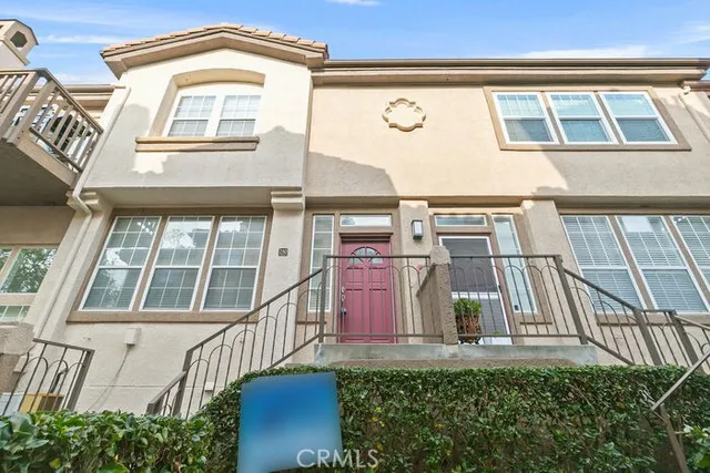 a view of a patio with table and chairs and potted plants