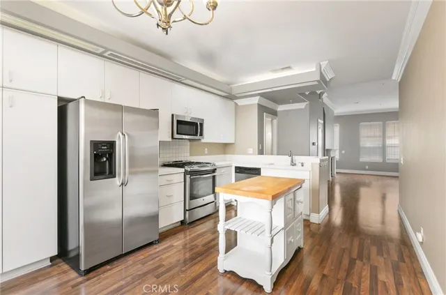 an empty room and chandelier fan