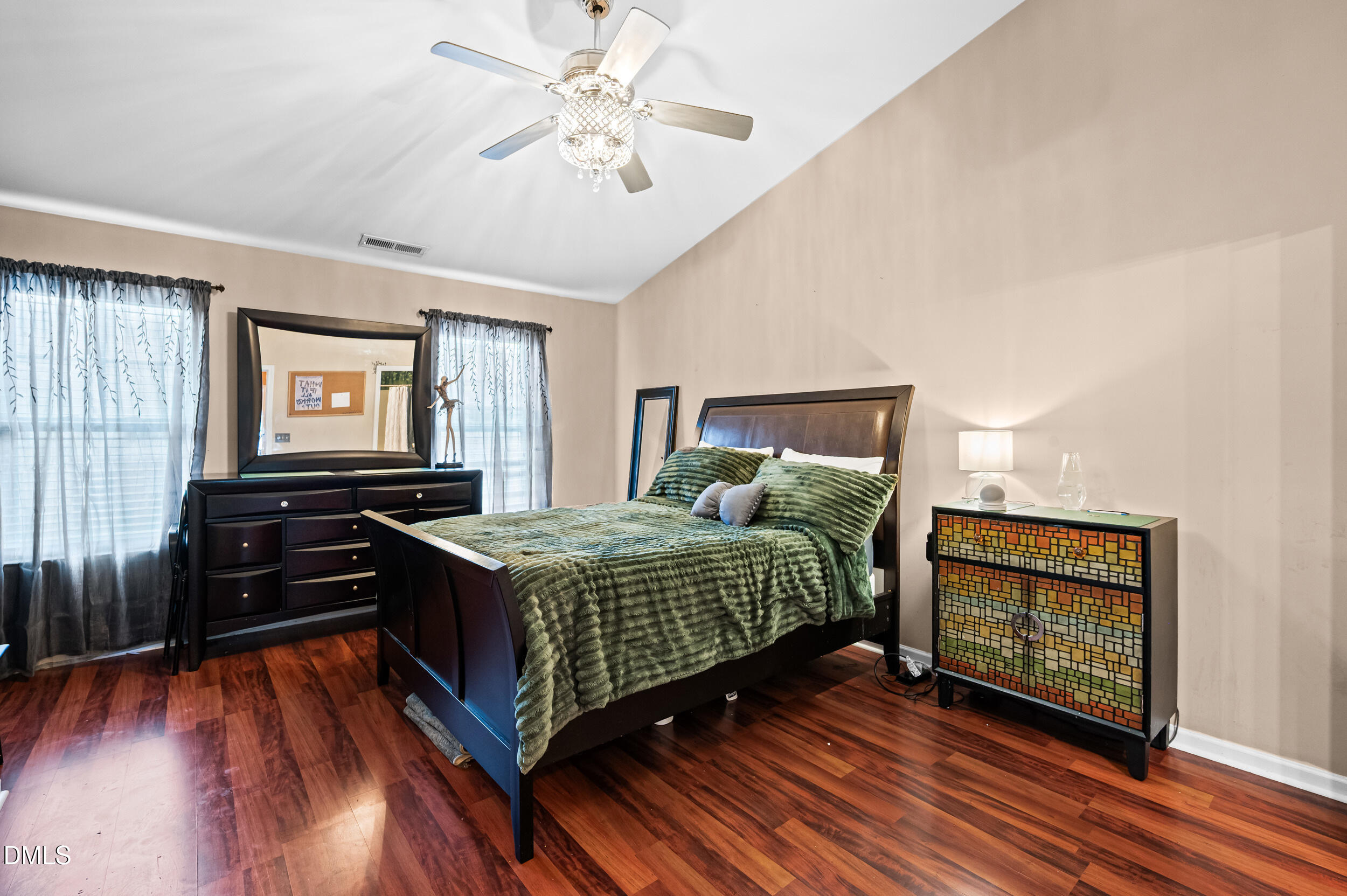 2944 Casona Way Raleigh, NC 27616 - Photo 13 of 24 a bedroom with a bed and wooden floor