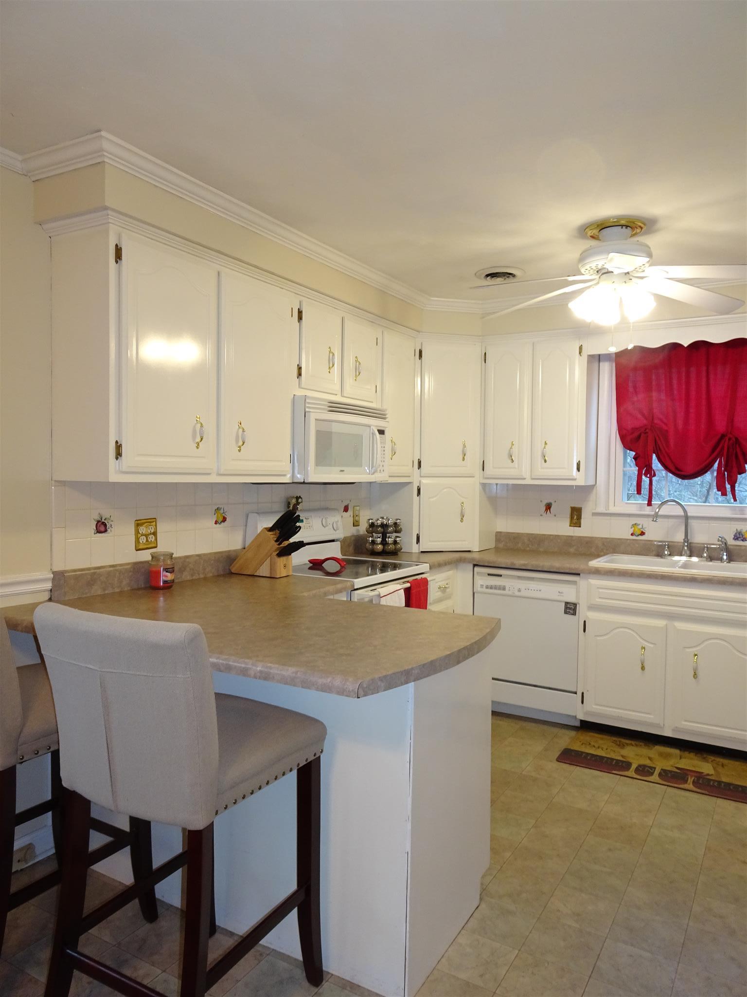 2143 Post Road Clarksville, TN 37043 - Photo 4 of 19 a kitchen with stainless steel appliances granite countertop a table chairs sink and cabinets