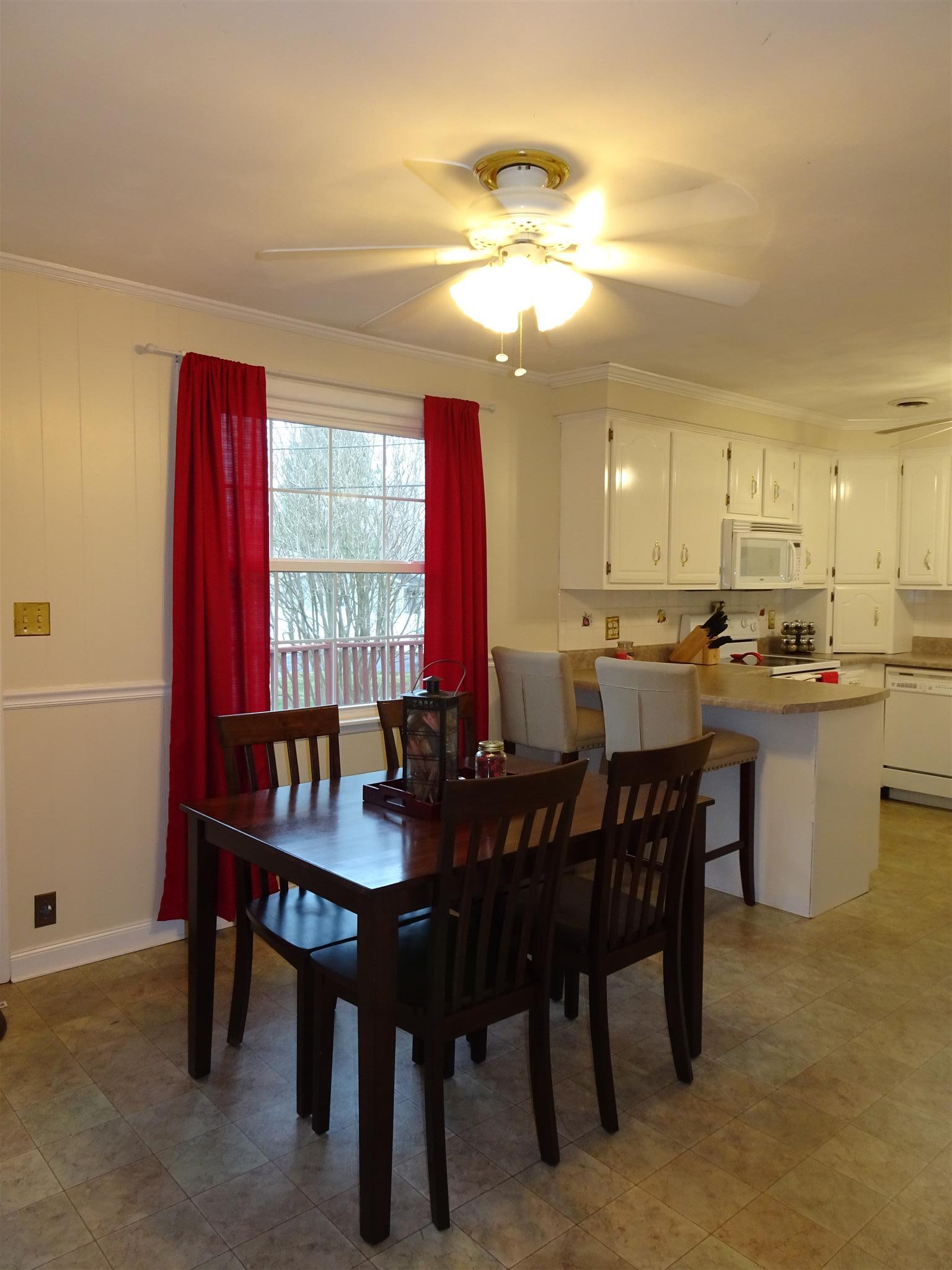 2143 Post Road Clarksville, TN 37043 - Photo 6 of 19 a view of a dining room with furniture and window