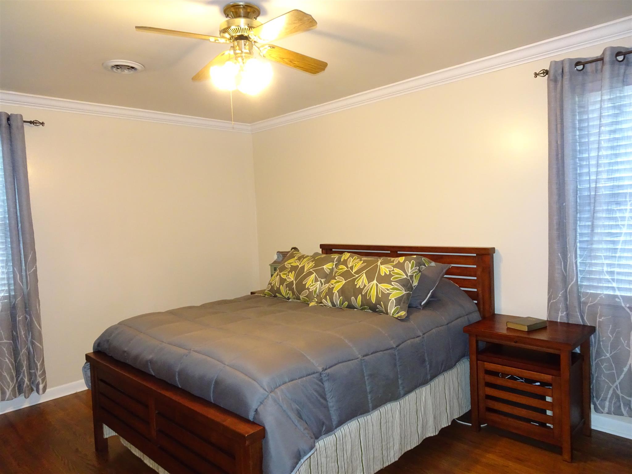 2143 Post Road Clarksville, TN 37043 - Photo 7 of 19 a bedroom with a bed and a chandelier