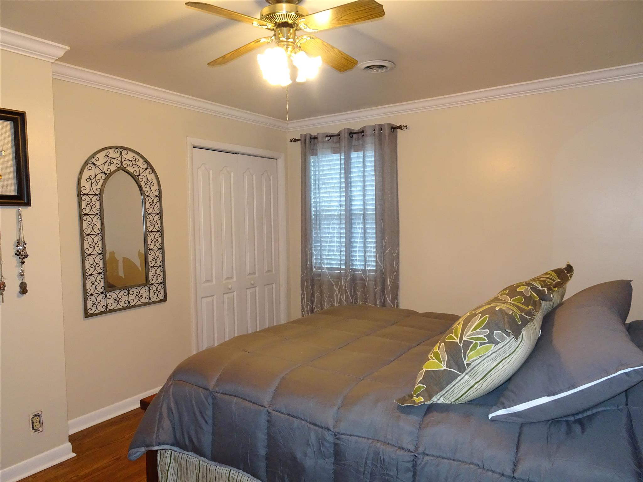 2143 Post Road Clarksville, TN 37043 - Photo 8 of 19 a bedroom with a bed and a chandelier