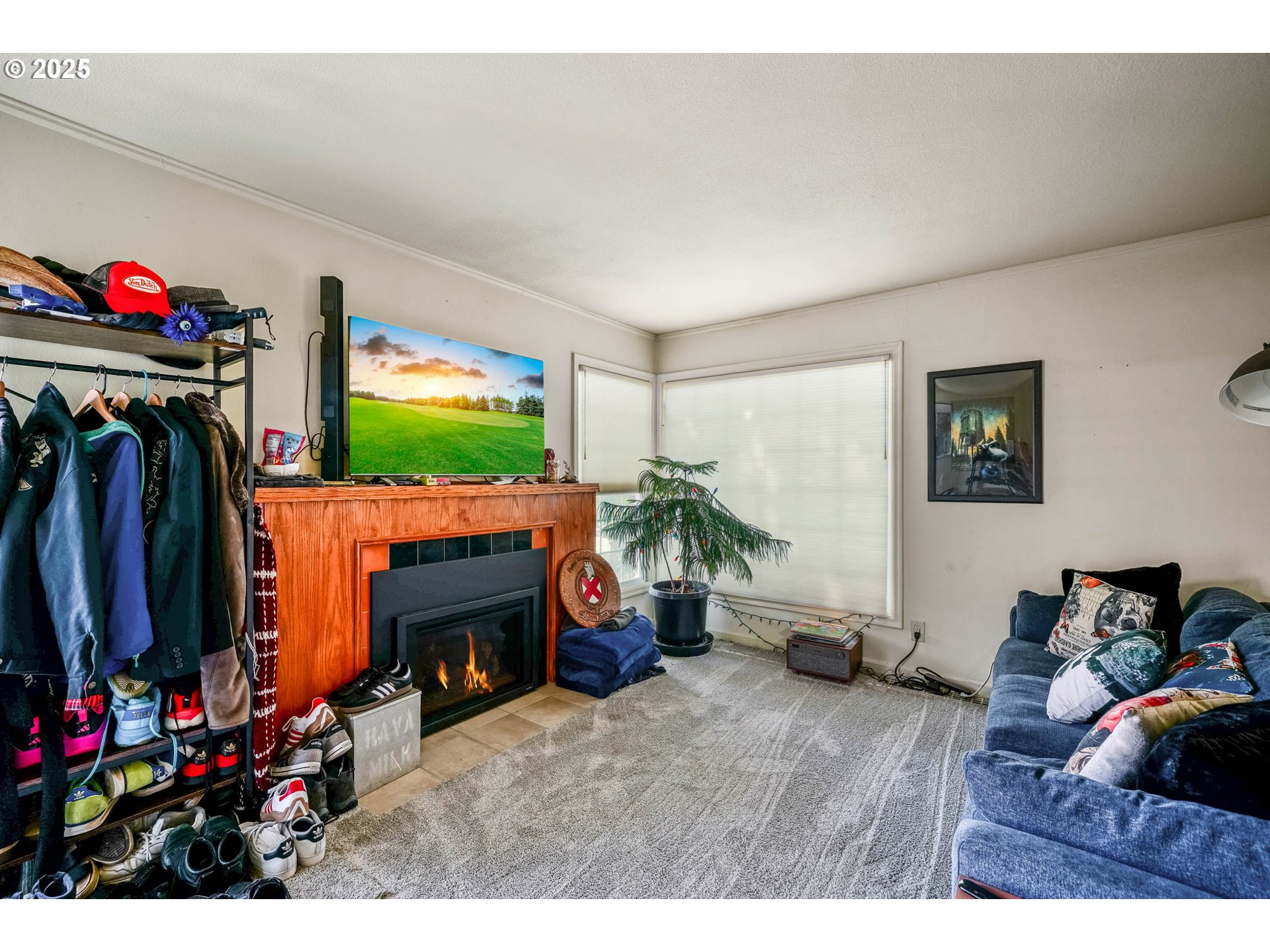 1908 Northeast 72nd Avenue Portland, OR 97213 - Photo 19 of 45 a living room with furniture a flat screen tv and a fireplace