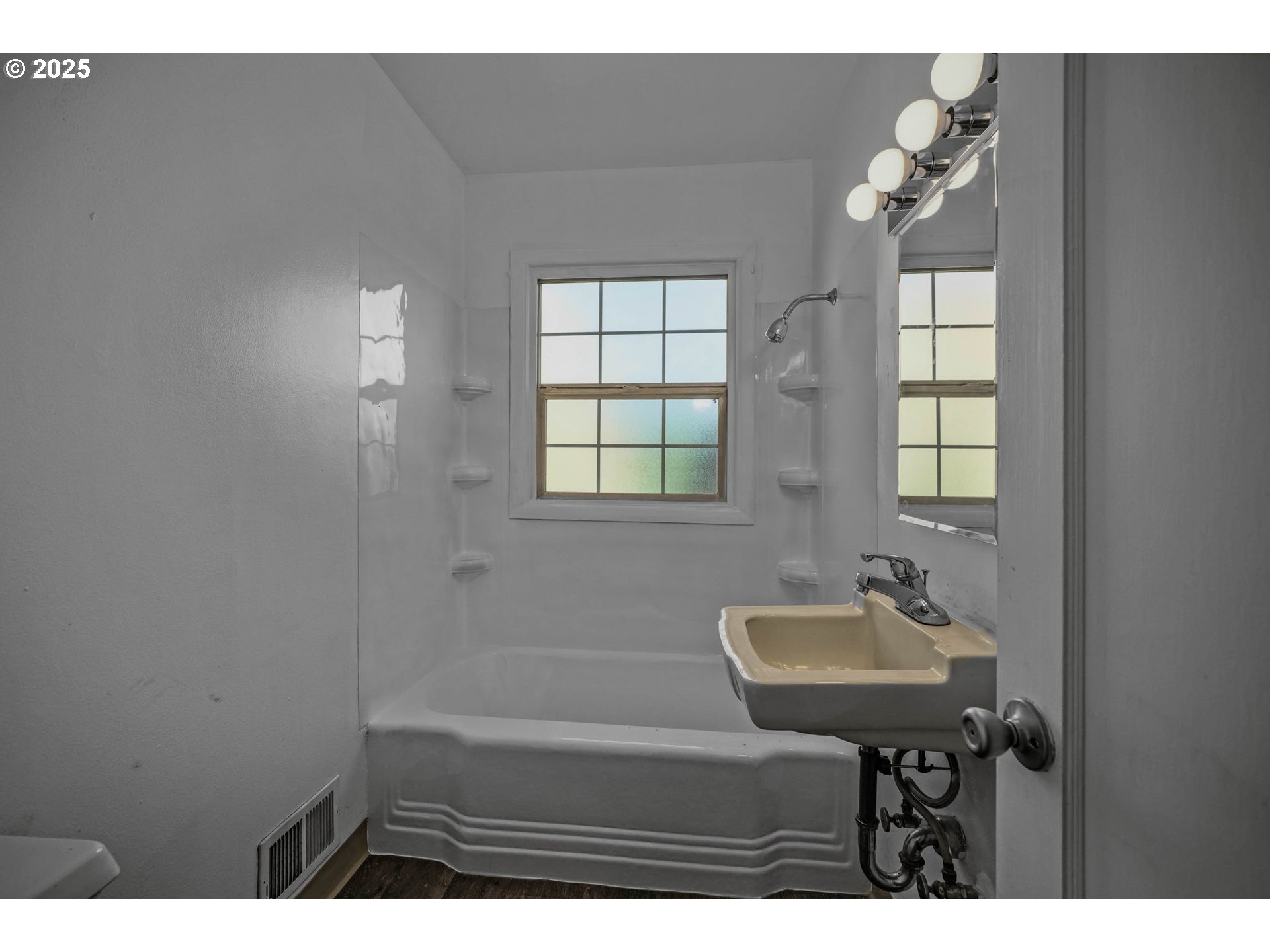 1908 Northeast 72nd Avenue Portland, OR 97213 - Photo 24 of 45 a bathroom with a sink a mirror and a bathtub
