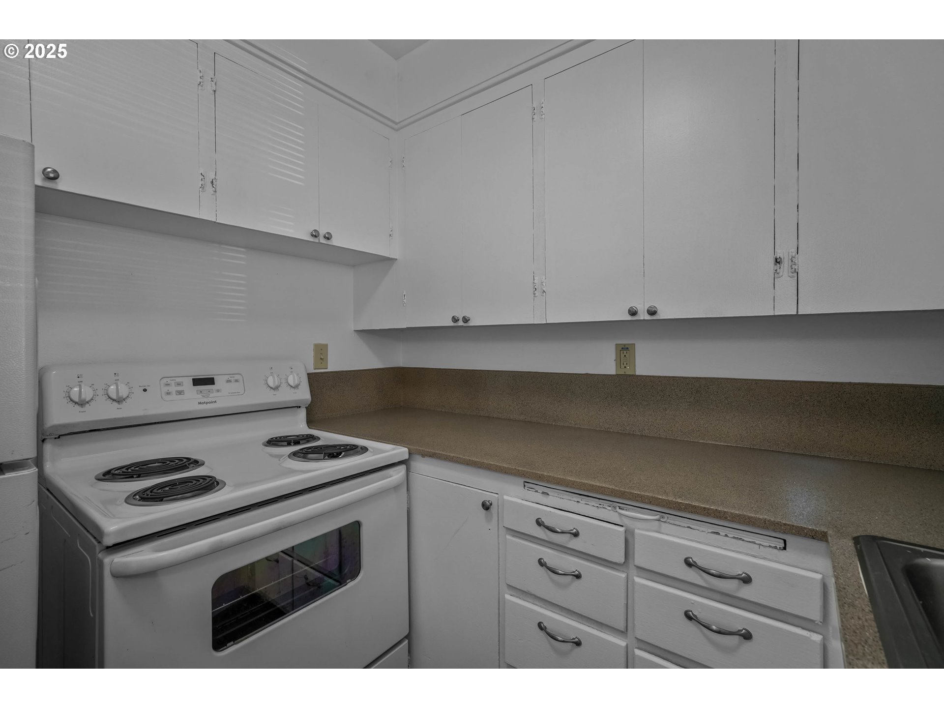 1908 Northeast 72nd Avenue Portland, OR 97213 - Photo 26 of 45 a kitchen with granite countertop white cabinets and white stove