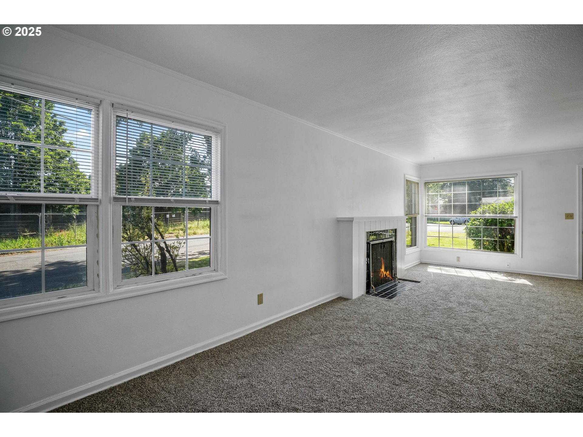 1908 Northeast 72nd Avenue Portland, OR 97213 - Photo 27 of 45 a view of empty room with windows and fireplace