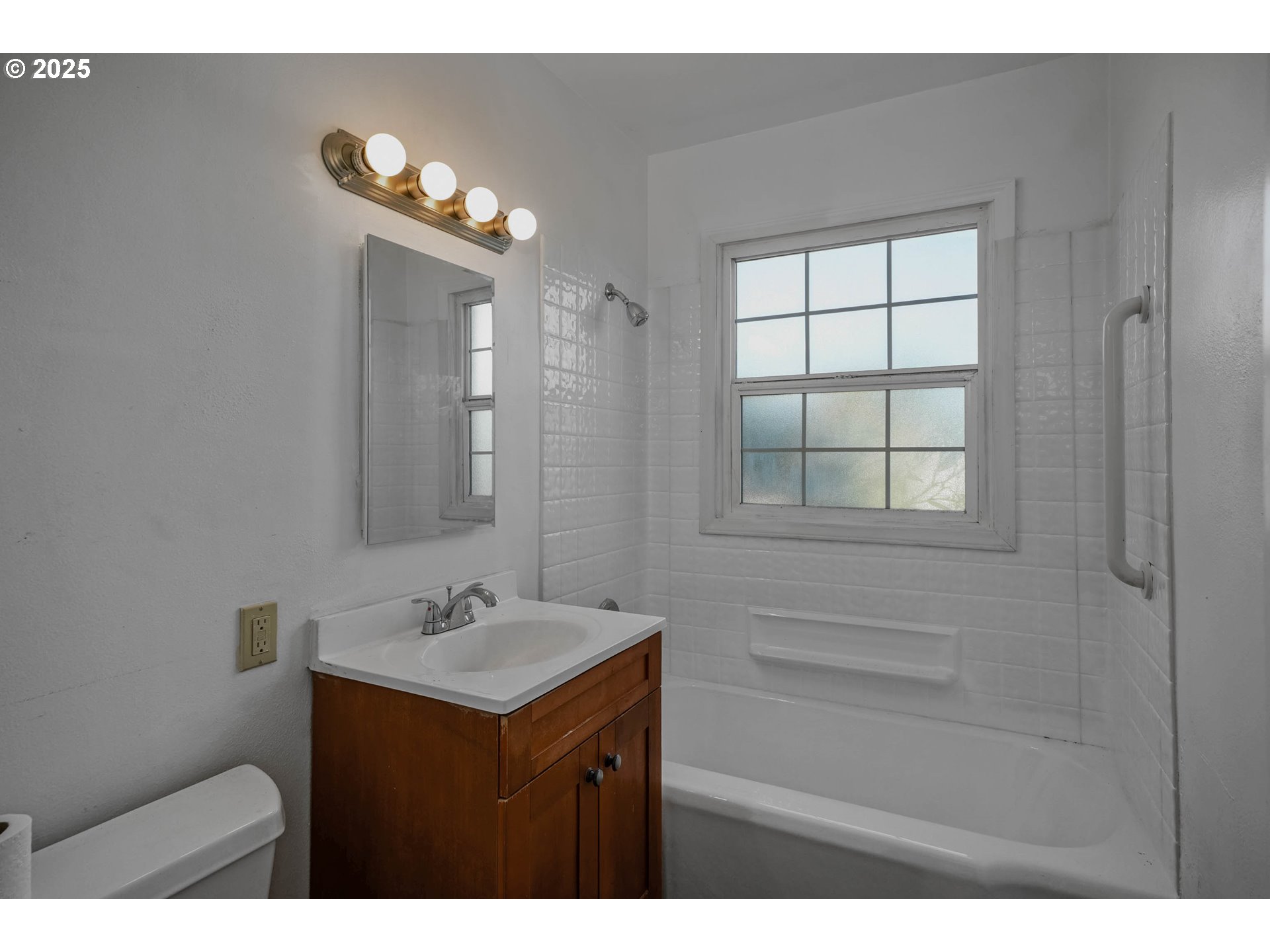 1908 Northeast 72nd Avenue Portland, OR 97213 - Photo 33 of 45 a bathroom with a sink vanity and a mirror