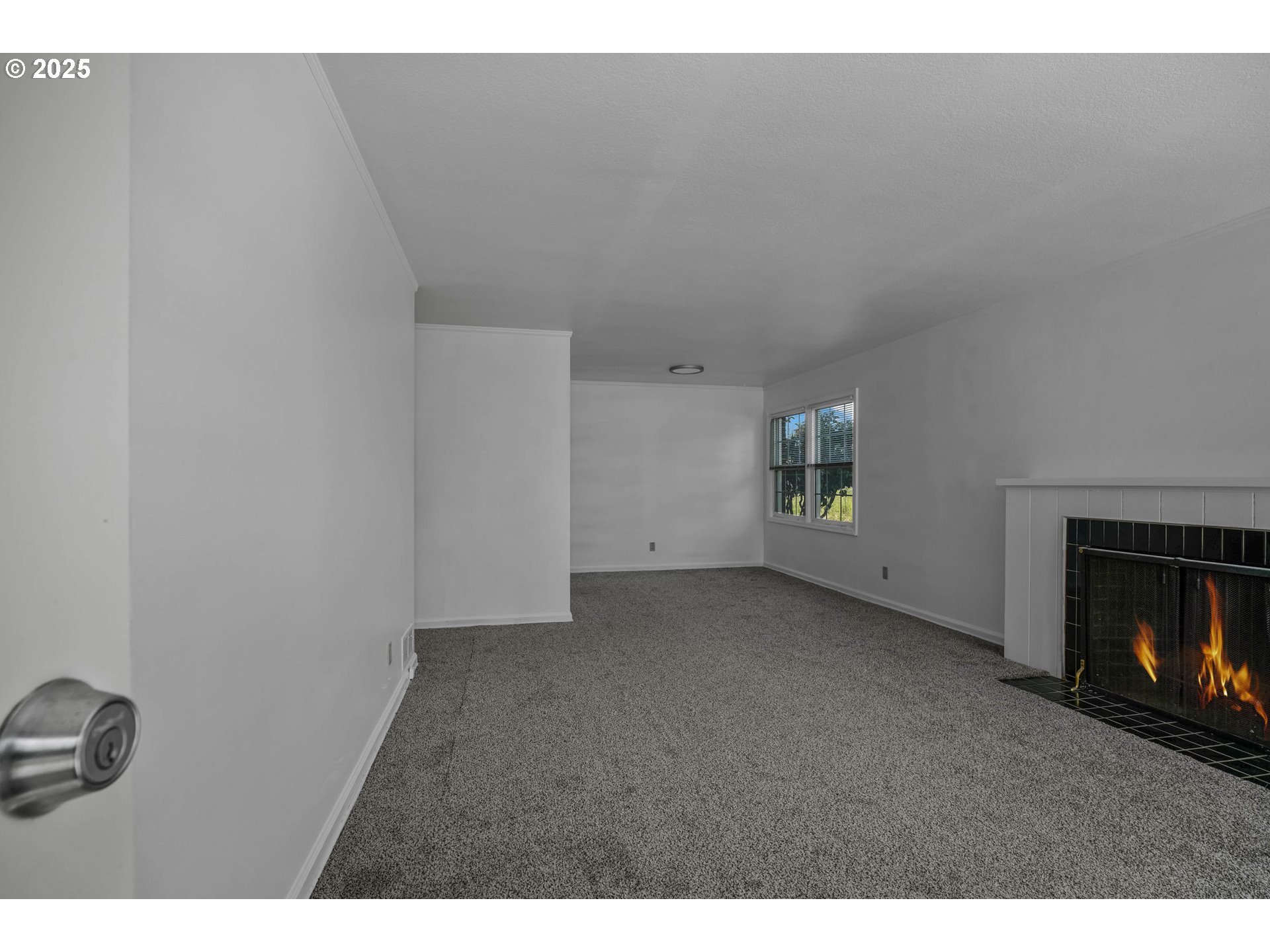 1908 Northeast 72nd Avenue Portland, OR 97213 - Photo 34 of 45 a view of an empty room with a fireplace and a window