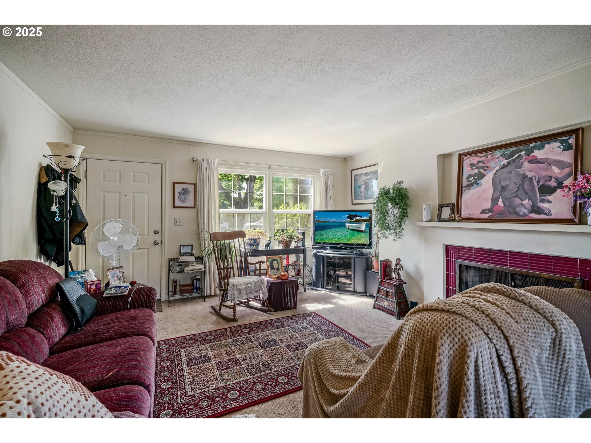 1908 Northeast 72nd Avenue Portland, OR 97213 - Photo 4 of 45 a bedroom with a bed and a couch