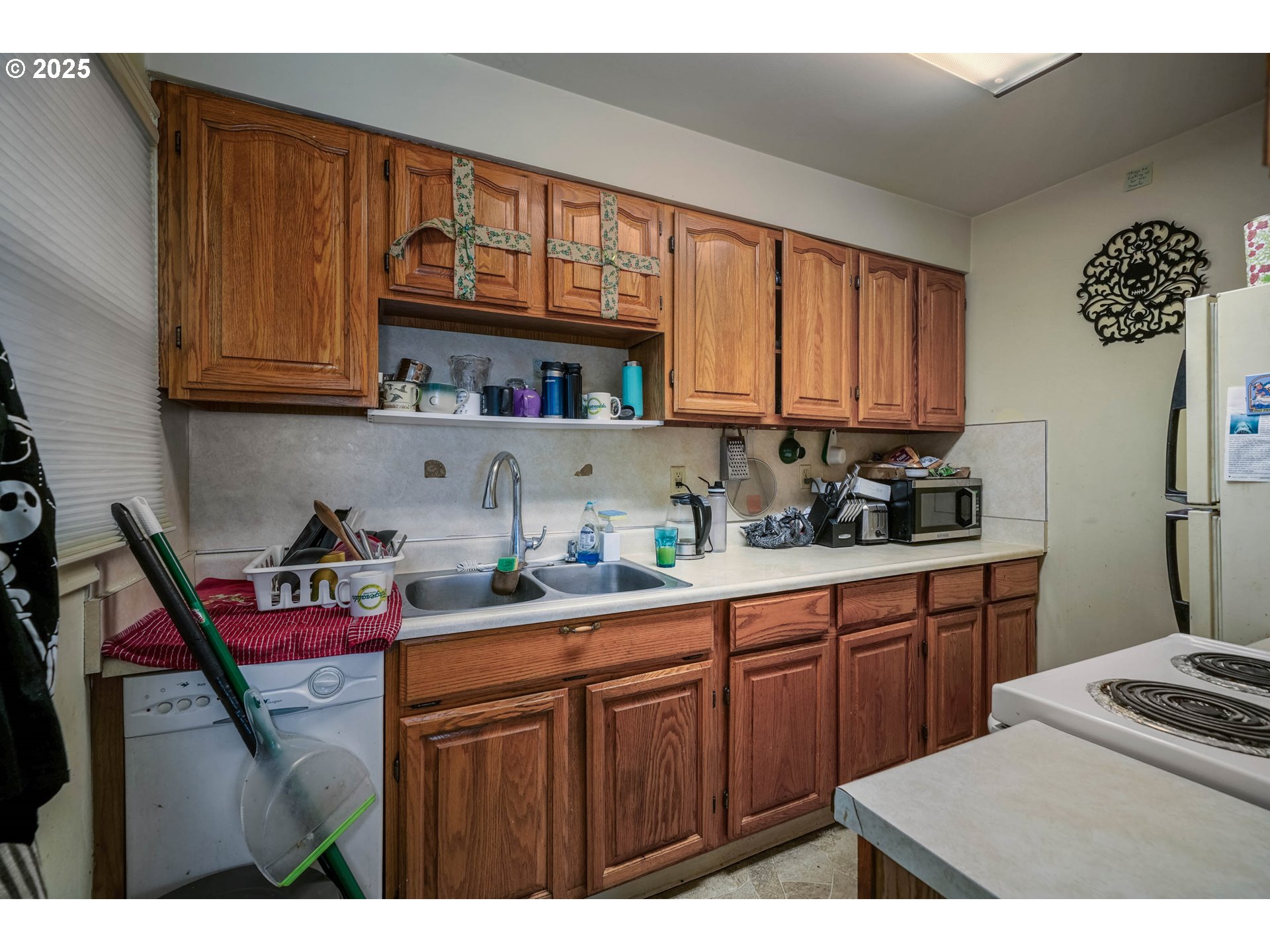 1908 Northeast 72nd Avenue Portland, OR 97213 - Photo 42 of 45 a kitchen with stainless steel appliances granite countertop a sink dishwasher stove and cabinets